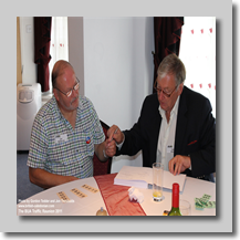 JT & Tony Realff signing Trevor Warburton’s raffle-winning prize – ‘The History of British Caledonian Airways’ written and donated by DT